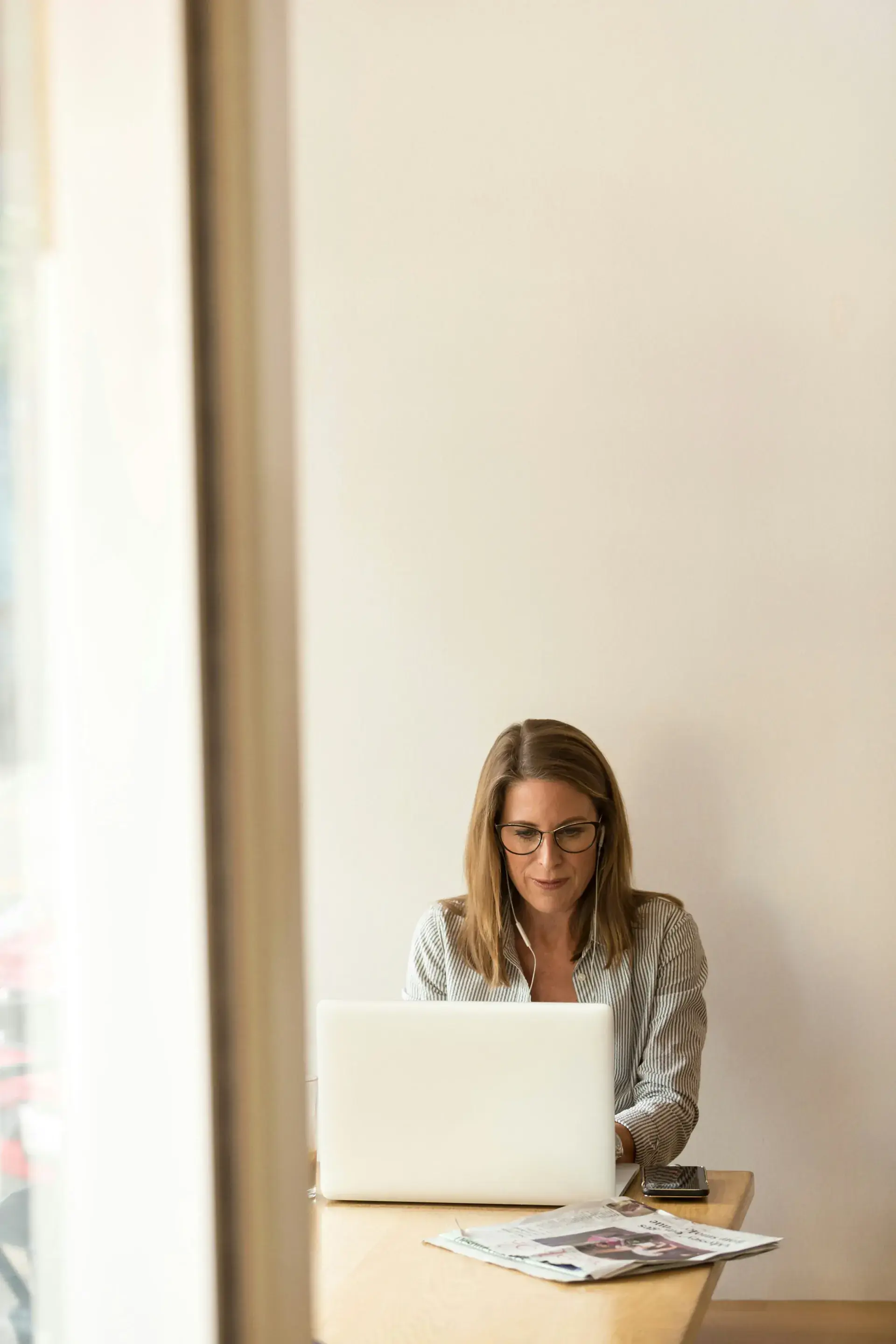 Accountant working quietly at a laptop in a bright office